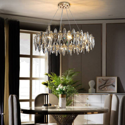 Smoke gray circular crystal chandelier above the dining table Cascadia